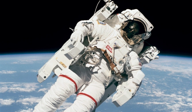 Bruce McCandless in free flight, participating in his historic extravehicular activity (EVA) with the Manned Maneuvering Unit from Space Shuttle Challenger.