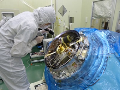 An instrument scientist inspects the Soft X-ray Spectrometer before its final closing. The instrument is one of four that will fly on the Japanese-led Astro-H mission launching in February.