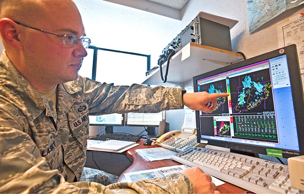 Staff Sgt Raymond Polasky points out changes in weather patterns on radar. The weather flight uses tools like weather sensors, satellites and radar to accurately forecast for eight different airframes