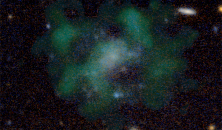 AGC 114905 - an ultra-diffuse dwarf galaxy that does not appear to contain any dark matter. Stellar emission of the galaxy is shown in blue, while the green clouds show the neutral hydrogen gas.  Image: Javier Román & Pavel Mancera Piña