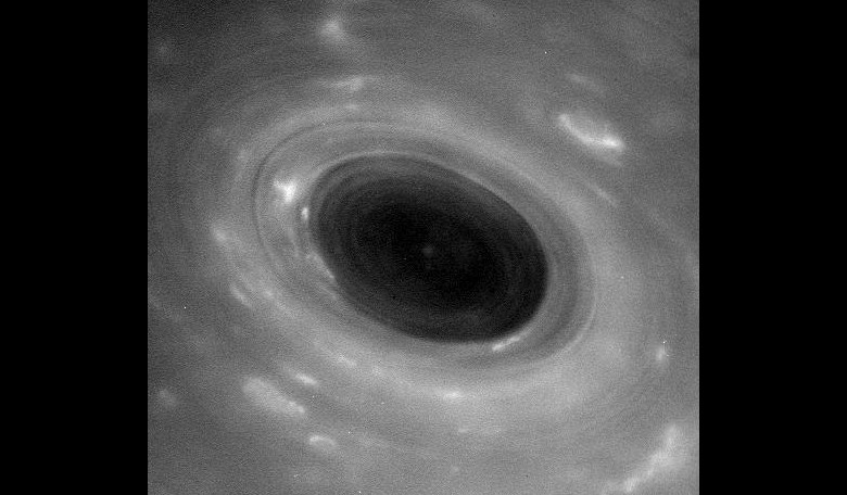 No, not a black hole but an unprocessed image showing features in Saturn's atmosphere from closer than ever before. The view was captured by NASA's Cassini spacecraft during its first Grand Finale dive past the planet on April 26, 2017. Credit: NASA/JPL