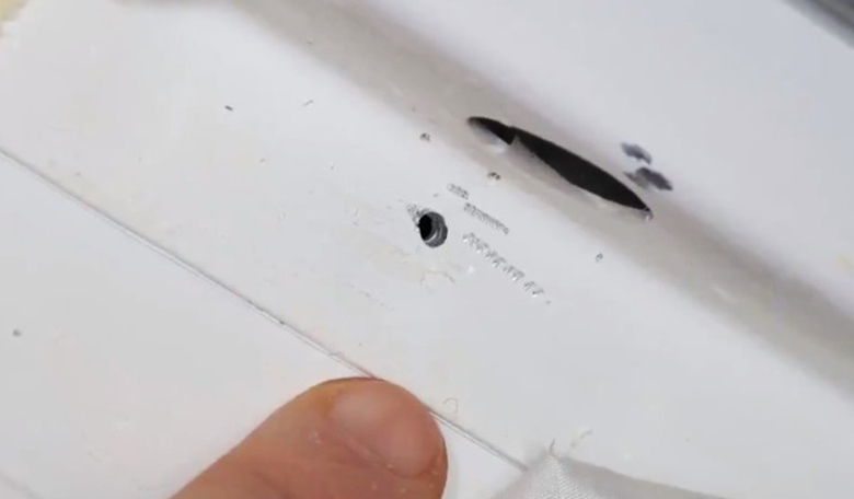 A photo of the hole in the Soyuz spacecraft’s orbital module released by NASA.