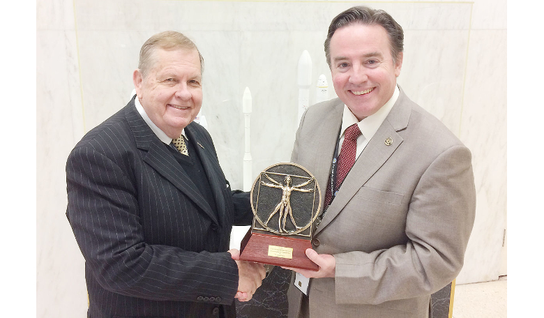 Joe Pelton receives the Leonardo da Vinci Award from Paul Wilde of the FAA Office of Space Commercialization at the 9th Annual Conference on Space Safety, Toulouse, France.