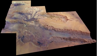 Valles Marineris, seen at an angle of 45 degrees to the surface in near-true colour and with four times vertical exaggeration. As much as 40% of the near-surface material in this huge canyon has just been found to contain water. Image: ESA/DLR/FU Berlin
