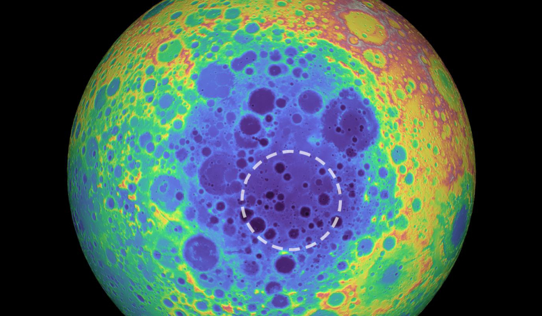 This false-color graphic shows the topography of the far side of the Moon. Warmer colors indicate high topography while blue indicates low topography. The dashed circle shows the anomalous mass. Image: NASA/University of Arizona