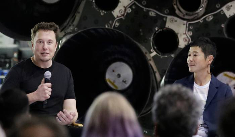 SpaceX founder Elon Musk (left), introducing Yusaku Maezawa as the first tourist to fly to the Moon in the company's anticipated Big Falcon Rocket (BFR)