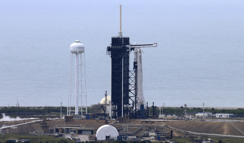 A gloomy day in Cape Canaveral today, as unfavourable weather conditions mean a delay to SpaceX's first crewed launch. 