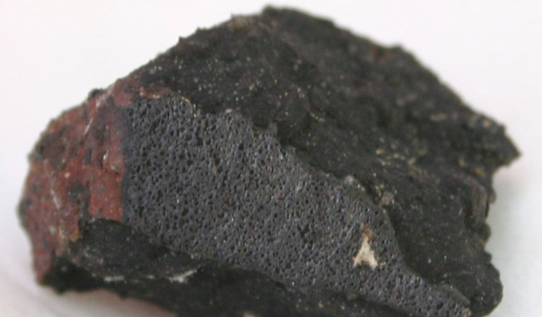 A chemical analysis of Sutter's Mill meteorite fragments (shown) suggest that this space rock holds the molecules necessary for life to develop. Image: K Heider/Wikimedia Commons.