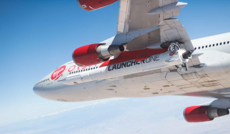 Virgin Orbit's LauncherOne vehicle strapped under the wing of 'Cosmic Girl', the company's modified Boeing 747. Its maiden flight into space has been scheduled for this Sunday, possible Monday depending on conditions. Image: Virgin Orbit