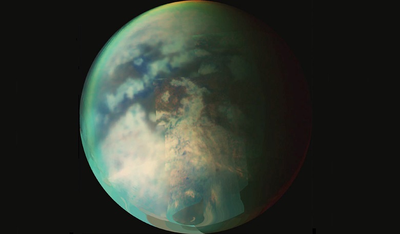 A composite taken during two separate Titan flybys. The large circular feature near the centre of Titan’s disk may be the remnant of a very old impact basin.