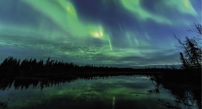 Auroras in morning twilight on 12 May 2021 in Northern Alberta, Canada.