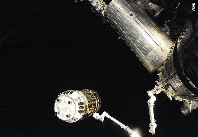 Canadarm2 captures the ISS’s first free-flying cargo vehicle, Japan’s HTV-1, in September 2009.