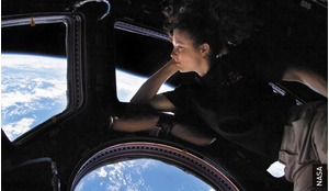 Astronaut Tracy Caldwell Dyson takes in the view of Earth from the ISS Cupola module.