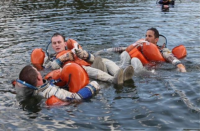 Cosmonaut Sergey Ryazansky and colleagues in training for post-splashdown action.