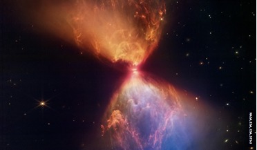 An hourglass-shaped, multi-colour cloud of dust and gas illuminated by light from a protostar, a star in the earliest stages of formation. The image was captured by NASA’s James Webb Space Telescope.