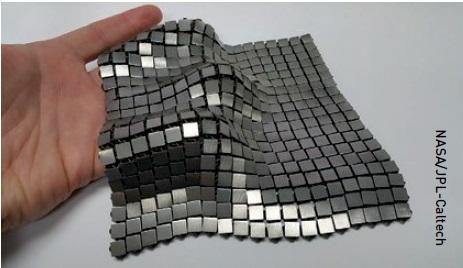 This flexible, strong metallic 3D-printed ‘chainmail’ fabric reflects heat and light on one side and absorbs light and controls heat on the other.