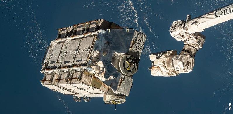 An external pallet packed with old nickel-hydrogen batteries is released by the ISS Canadarm2 robotic arm in March 2021.