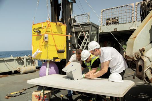 Preparation of a stratospheric balloon during an ocean launch from a ship.