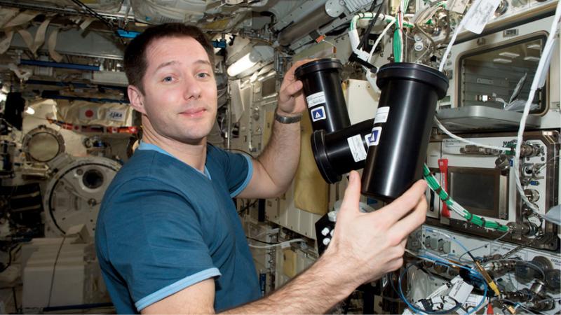 NASA astronaut Thomas Pesquet removing the Protein Crystallization Facility
