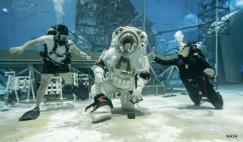 NASA astronaut Loral O’Hara kneels to pick up a rock while testing the mobility of Axiom Space’s lunar spacesuit. NASA and Axiom Space teams held the first dual spacesuit run at the Neutral Buoyancy Laboratory in Houston in September 2025 with astronauts Stan Love and Loral O’Hara. This was the final integration test in the pool, proving both the spacesuit and facility are prepped and ready for Artemis mission training.