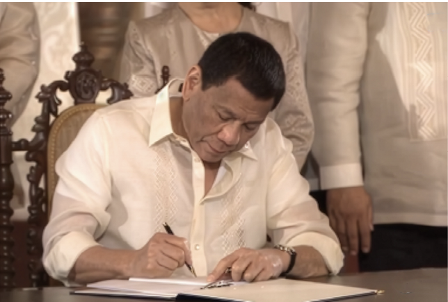 President Rodrigo Duterte signs the Philippine Space Act (RA 11363), August 2019.