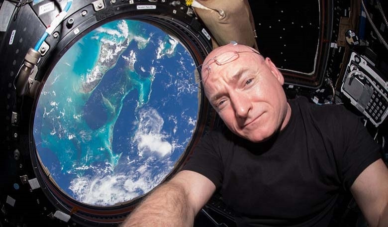 NASA astronaut Scott Kelly inside the cupola of the International Space Station, a special module that provides a 360-degree viewing of the Earth and the station. Kelly will return to Earth on March 1, marking completion of a 340-day mission in space.
