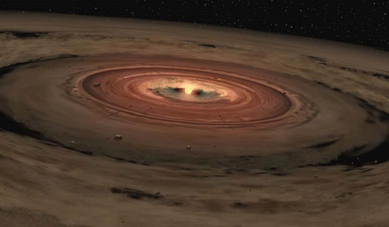 This artist's concept shows a very young star encircled by a disk of gas and dust, the raw materials from which rocky planets such as Earth are thought to form. Image credit: NASA/JPL-Caltech